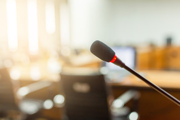 Microphone over the blurred business forum Meeting or Conference Training Learning Coaching Room Concept, Blurred background