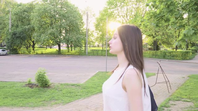 Mother and adult daughter swear and chatting in the park on a sunny day