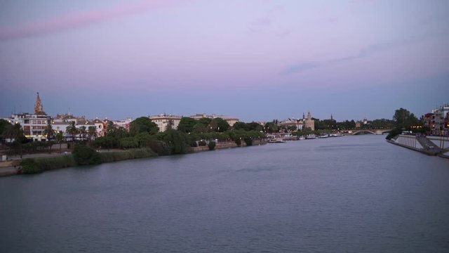 City skyline of Seville along Guadalquivir River at late evening, Seville, Andalusia, Spain.