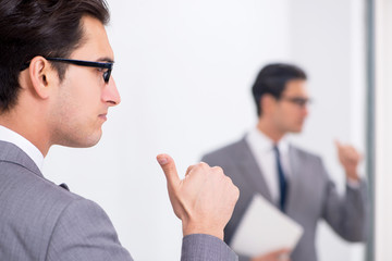 Politician planning speach in front of mirror