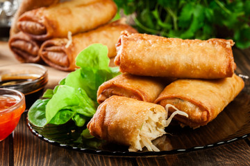 Spring rolls with chicken and vegetables served with sweet chili sauce or soy sauce