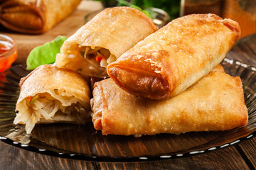 Spring rolls with chicken and vegetables served with sweet chili sauce or soy sauce
