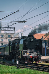 Fototapeta na wymiar STEAM LOCOMOTIVE - Vintage train at the station