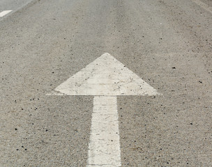 forward white arrow on the road