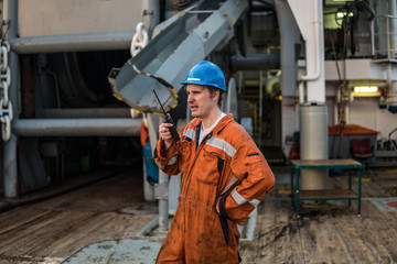 Marine Deck Officer or Chief mate on deck of offshore vessel or ship , wearing PPE personal...
