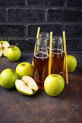 Bottles with fresh apple juice 