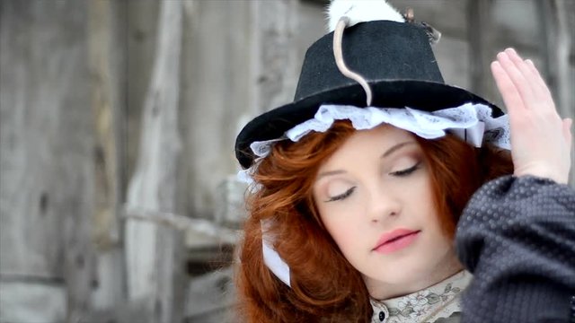 Red-haired girl with a magic rat. Fairy tale characters. close-up