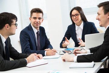 Businesspeople discuss a new project