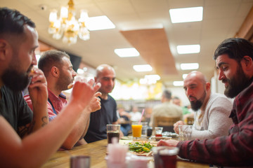 Muslim people enjoying a traditional Iftar meal