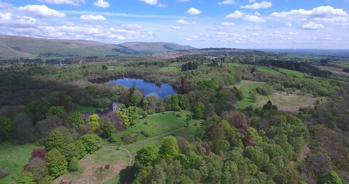 Aerial footage over Mugdock Country Park near Milngavie in Central Scotland.