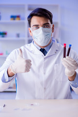 Lab assistant testing blood samples in hospital