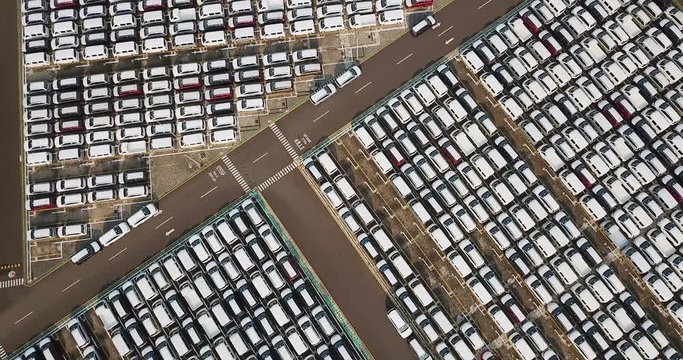 Aerial footage of new cars parked outside