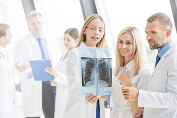 Group of doctors discuss x-ray