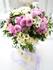 Bouquet of chrysanthemum flowers yellow and purple on white