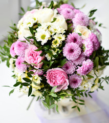 Bouquet of chrysanthemum flowers yellow and purple on white