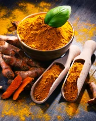 Poster Composition with bowl of turmeric powder on wooden table © monticellllo