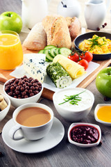 Breakfast served with coffee, cheese, cereals and scrambled eggs