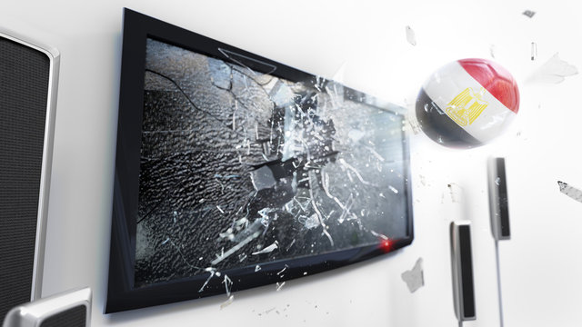 Soccer ball with the flag of Egypt kicked through a shattering tv screen.(3D rendering series)