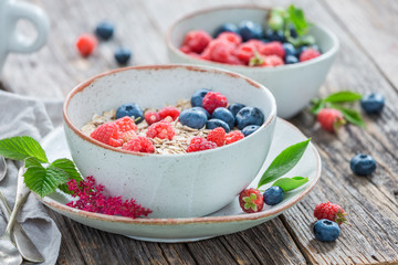 Tasty oat flakes with milk and fresh fruits