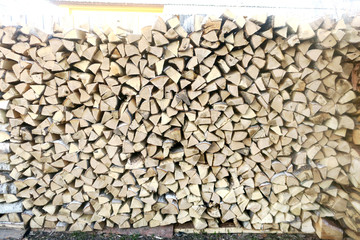 A large stack of stacked firewood.