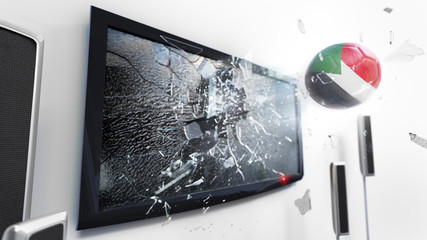 Soccer ball with the flag of Sudan kicked through a shattering tv screen.(3D rendering series)