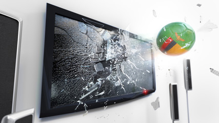 Soccer ball with the flag of Zambia kicked through a shattering tv screen.(3D rendering series)