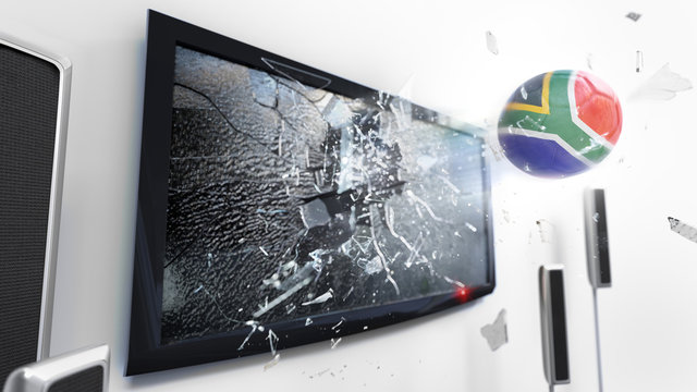 Soccer ball with the flag of South Africa kicked through a shattering tv screen.(3D rendering series)
