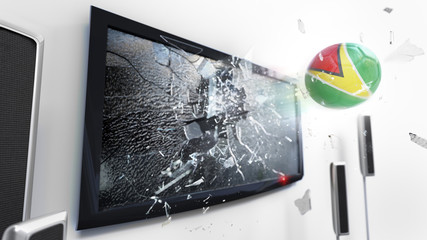 Soccer ball with the flag of Guyana kicked through a shattering tv screen.(3D rendering series)