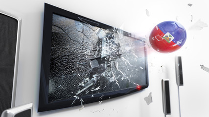 Soccer ball with the flag of Haiti kicked through a shattering tv screen.(3D rendering series)
