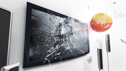 Soccer ball with the flag of Bhutan kicked through a shattering tv screen.(3D rendering series)