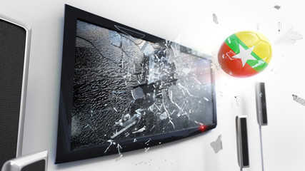 Soccer ball with the flag of Burma kicked through a shattering tv screen.(3D rendering series)