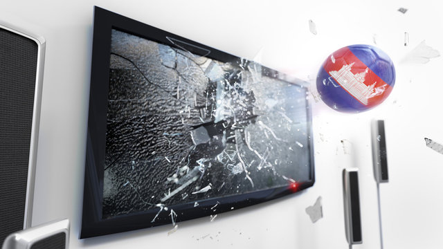 Soccer ball with the flag of Cambodia kicked through a shattering tv screen.(3D rendering series)
