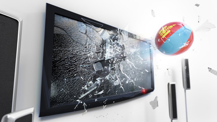 Soccer ball with the flag of Mongolia kicked through a shattering tv screen.(3D rendering series)