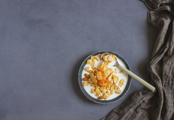 Eco healthy food background. Corn flakes with milk . Top view image