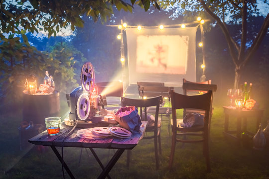 Cinema With Old Analog Films In Summer Garden The Evening