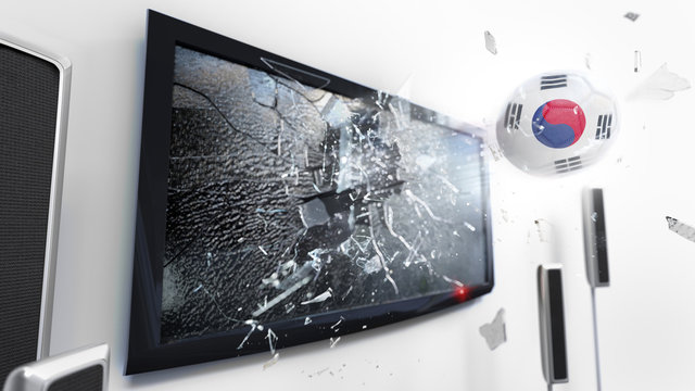 Soccer ball with the flag of South Korea kicked through a shattering tv screen.(3D rendering series)