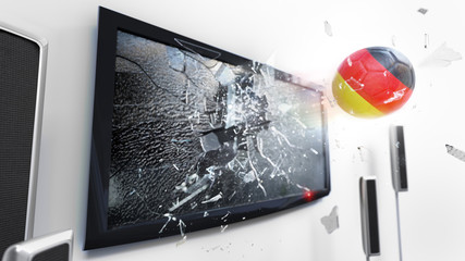 Soccer ball with the flag of Germany kicked through a shattering tv screen.(3D rendering series)