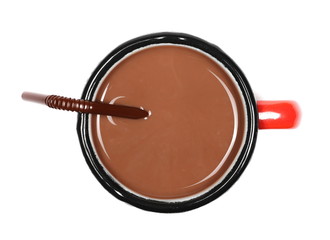 Chocolate milk puddle in metal cup isolated on white background, top view