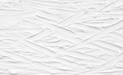 Obraz premium White background. Texture of paint and plaster on the wall with patterns and stripes.
