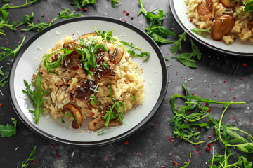 Italian Mushroom risotto with parmesan cheese and wild rocket on top.