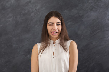 Smiling woman wink to camera