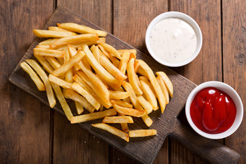 French fries on wooden table