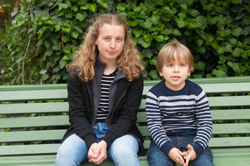 Brothers sitting on a bench