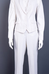 Formal style waistcoat and trousers. Female business style suit on mannequin. Store of elegant garment for women.