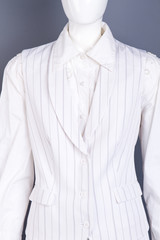 White shirt and waistcoat for women. Female sleeveles formal style vest on dummy. Exclusive apparel for women.