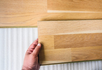 hand installing floor wooden laminate