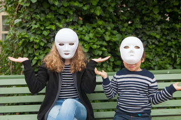 Girl and boy with a white mask. What happened?