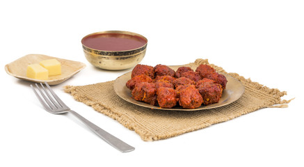 Indian Cuisine Vegetable Manchurian Also Know as Gobi Manchurian is a popular Indo Chinese Street food isolated on white background