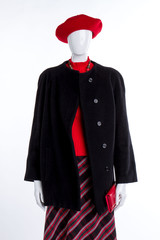 Female red beret, sweater and wallet. Female mannequin clothed in hat, overcoat and skirt. Ladies elegant clothes and accessories.