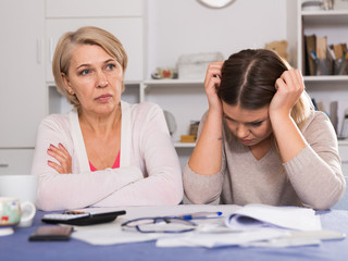 mother and her adult daughter with financial problems